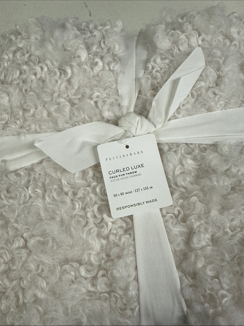 NWT Pottery Barn Curled Luxe faux fur throw.  Ivory 50x60.